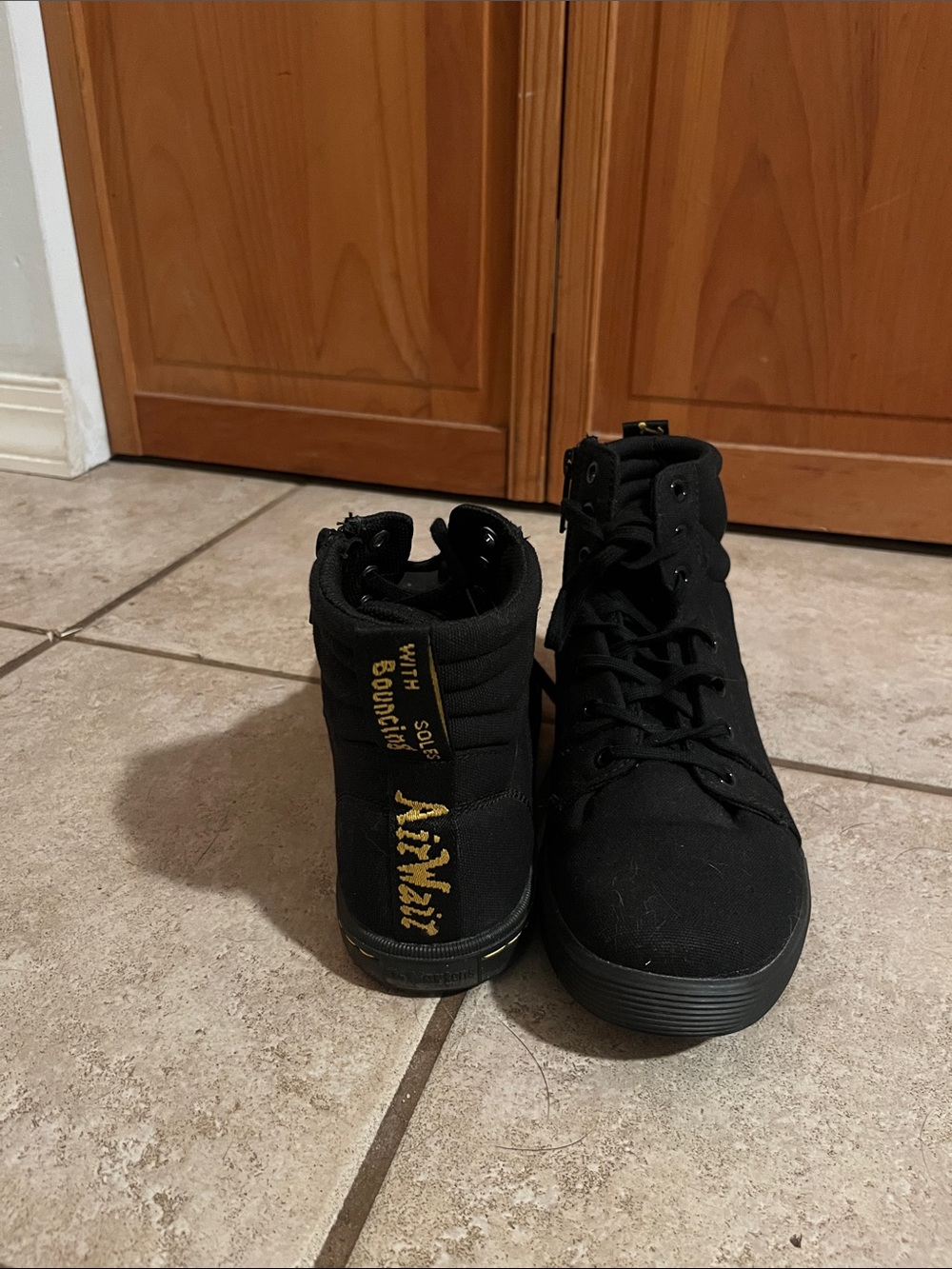 Dr. Martens Black High-Top Sneakers with Gold Logo Detail